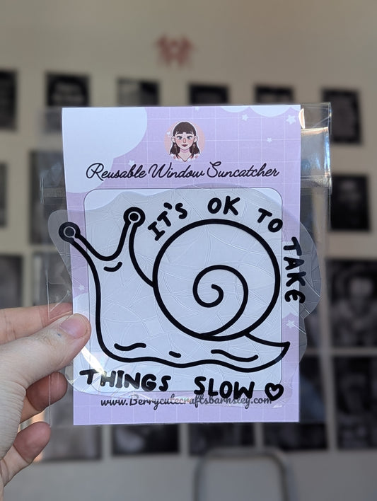 Take things slow snail blk suncatcher